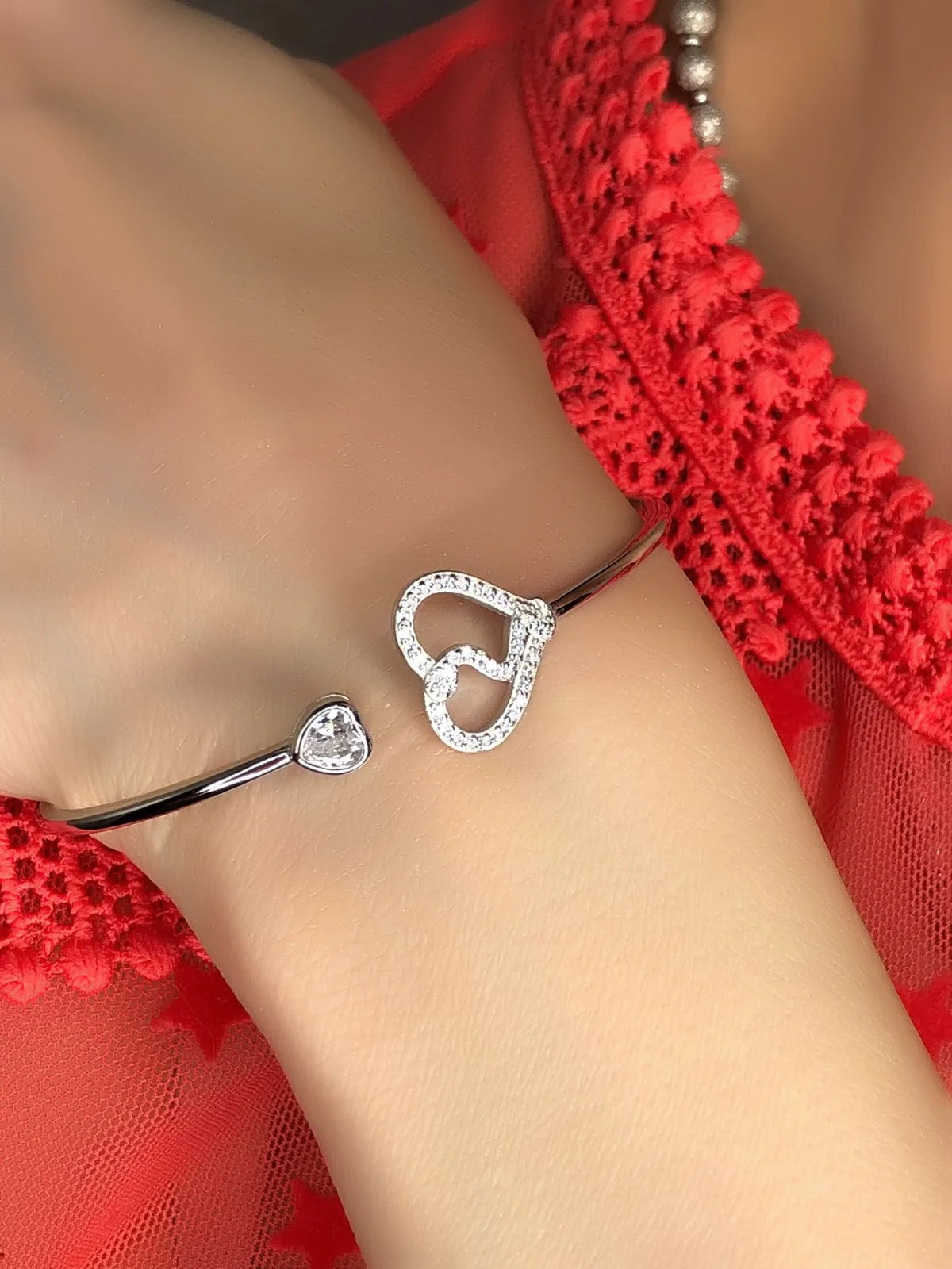 Bracciale rigido due cuori in argento 925
