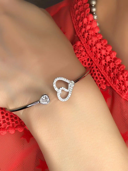 Bracciale rigido due cuori in argento 925